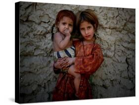 Afghan Girl Holds Her Younger Sister in Nangarhar Province, East of Kabul, Afghanistan-null-Stretched Canvas