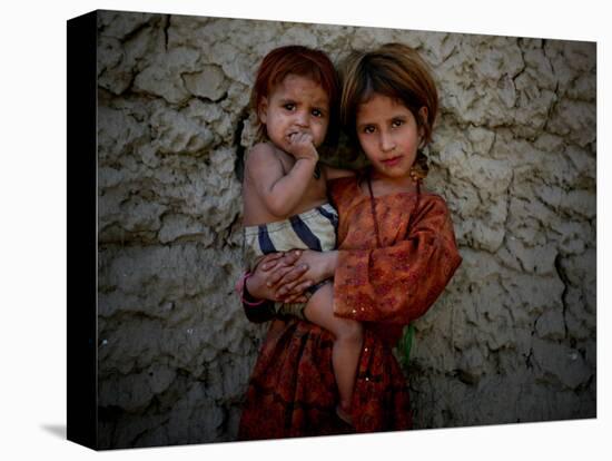 Afghan Girl Holds Her Younger Sister in Nangarhar Province, East of Kabul, Afghanistan-null-Stretched Canvas