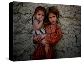 Afghan Girl Holds Her Younger Sister in Nangarhar Province, East of Kabul, Afghanistan-null-Stretched Canvas