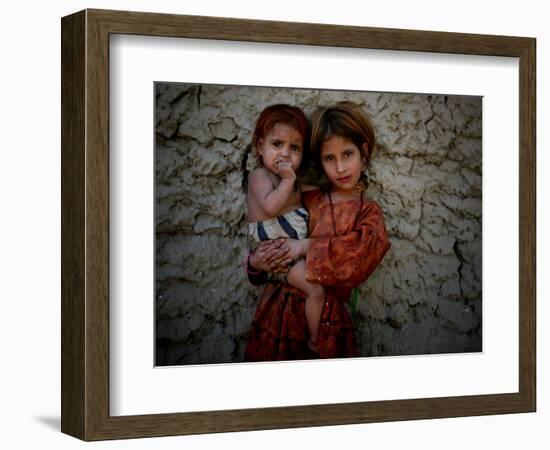 Afghan Girl Holds Her Younger Sister in Nangarhar Province, East of Kabul, Afghanistan-null-Framed Photographic Print