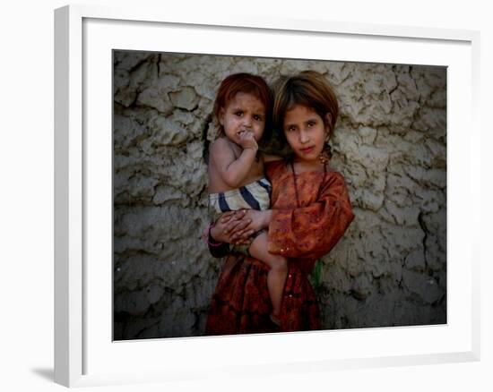 Afghan Girl Holds Her Younger Sister in Nangarhar Province, East of Kabul, Afghanistan-null-Framed Photographic Print