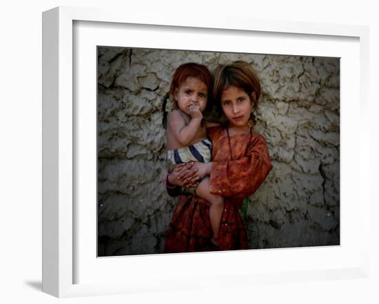 Afghan Girl Holds Her Younger Sister in Nangarhar Province, East of Kabul, Afghanistan-null-Framed Photographic Print