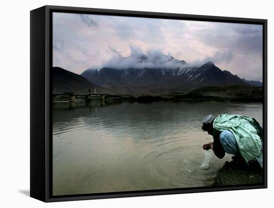 Afghan Man Washes His Face in the River before Going to Evening Prayers-null-Framed Stretched Canvas