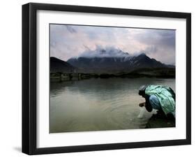 Afghan Man Washes His Face in the River before Going to Evening Prayers-null-Framed Photographic Print