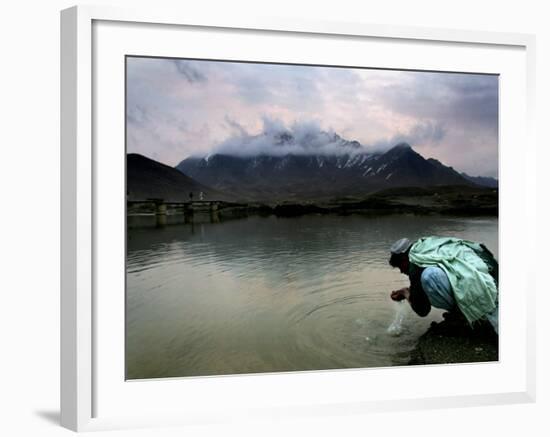 Afghan Man Washes His Face in the River before Going to Evening Prayers-null-Framed Photographic Print