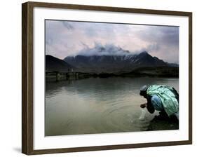 Afghan Man Washes His Face in the River before Going to Evening Prayers-null-Framed Photographic Print