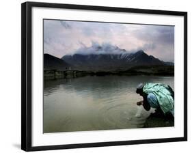 Afghan Man Washes His Face in the River before Going to Evening Prayers-null-Framed Photographic Print