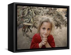 Afghan Refugee Child Looks on in a Neighborhood of Rawalpindi, Pakistan-null-Framed Stretched Canvas