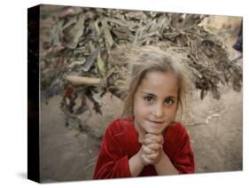 Afghan Refugee Child Looks on in a Neighborhood of Rawalpindi, Pakistan-null-Stretched Canvas