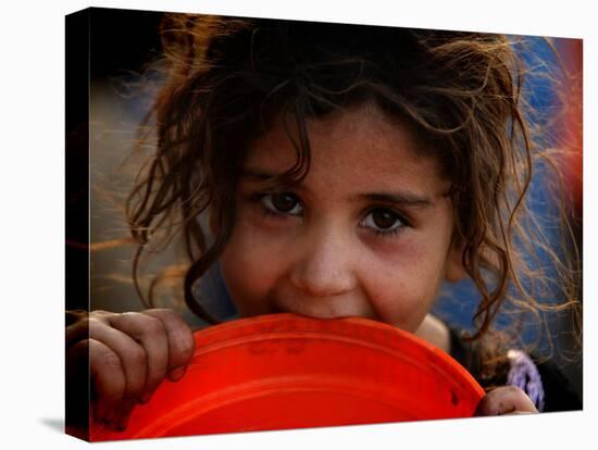 Afghan Refugee Child Who Lives in Slum Area of Lahore City in Pakistan Waits to Get Water-null-Stretched Canvas