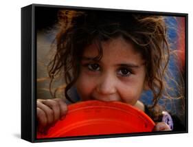 Afghan Refugee Child Who Lives in Slum Area of Lahore City in Pakistan Waits to Get Water-null-Framed Stretched Canvas