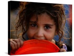 Afghan Refugee Child Who Lives in Slum Area of Lahore City in Pakistan Waits to Get Water-null-Stretched Canvas