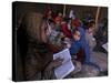 Afghan Refugee Children Holding Copies of the Quran, Repeat after their Teacher-null-Stretched Canvas