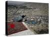 Afghan Youth Sits on a Rooftop During the Celebration of Nowruz-null-Stretched Canvas