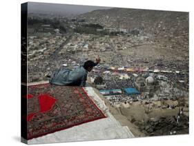 Afghan Youth Sits on a Rooftop During the Celebration of Nowruz-null-Stretched Canvas