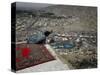 Afghan Youth Sits on a Rooftop During the Celebration of Nowruz-null-Stretched Canvas