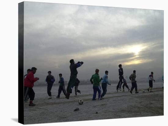 Afghan Youths Warm up Themselves Before a Soccer Match-null-Stretched Canvas