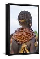 Africa, Ethiopia, Southern Omo Valley. Nyangatom woman wear heavy beads and other decorations.-Ellen Goff-Framed Stretched Canvas