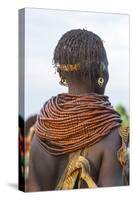 Africa, Ethiopia, Southern Omo Valley. Nyangatom woman wear heavy beads and other decorations.-Ellen Goff-Stretched Canvas