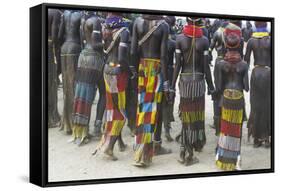 Africa, Ethiopia, Southern Omo Valley. Nyangatom women wear long leather skirts with beadwork.-Ellen Goff-Framed Stretched Canvas