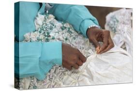 Africa, Gambia, Banjul. Close-up of Woman tying fabric for dyeing.-Alida Latham-Stretched Canvas