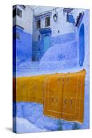 Africa, Morocco, Chefchaouen. Rugs Draped on a Wall in the Blue Town-Brenda Tharp-Stretched Canvas