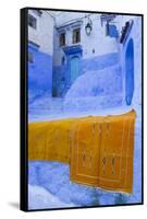 Africa, Morocco, Chefchaouen. Rugs Draped on a Wall in the Blue Town-Brenda Tharp-Framed Stretched Canvas