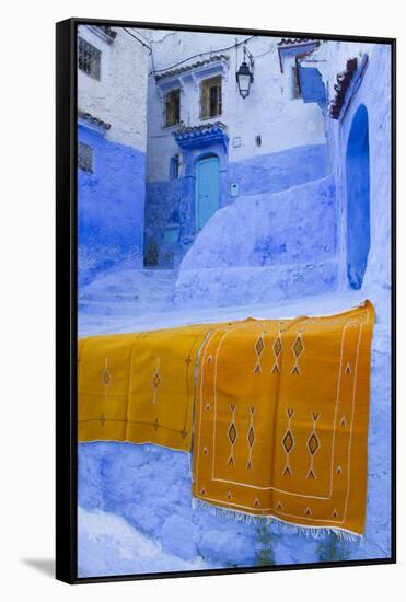 Africa, Morocco, Chefchaouen. Rugs Draped on a Wall in the Blue Town-Brenda Tharp-Framed Stretched Canvas