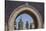 Africa, Morocco, Fes. an Arch with Classic Moorish Decor Frames Two Minarets-Brenda Tharp-Stretched Canvas