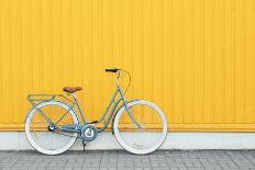 Retro Bicycle near Yellow Wall Outdoors-Africa Studio-Mounted Photographic Print