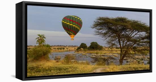 Africa. Tanzania. Hot air balloon crossing the Mara River, Serengeti National Park.-Ralph H. Bendjebar-Framed Stretched Canvas