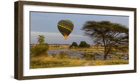 Africa. Tanzania. Hot air balloon crossing the Mara River, Serengeti National Park.-Ralph H. Bendjebar-Framed Photographic Print