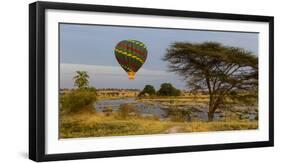 Africa. Tanzania. Hot air balloon crossing the Mara River, Serengeti National Park.-Ralph H. Bendjebar-Framed Photographic Print