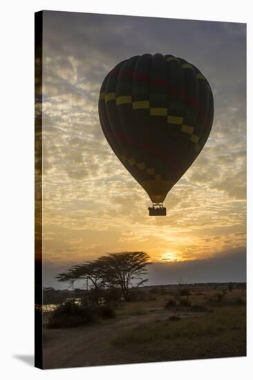 Africa. Tanzania. Hot air balloon crossing the Mara River, Serengeti National Park.-Ralph H. Bendjebar-Stretched Canvas