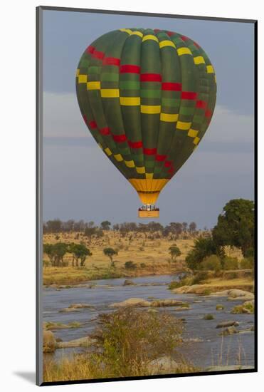 Africa. Tanzania. Hot air balloon crossing the Mara River, Serengeti National Park.-Ralph H. Bendjebar-Mounted Photographic Print
