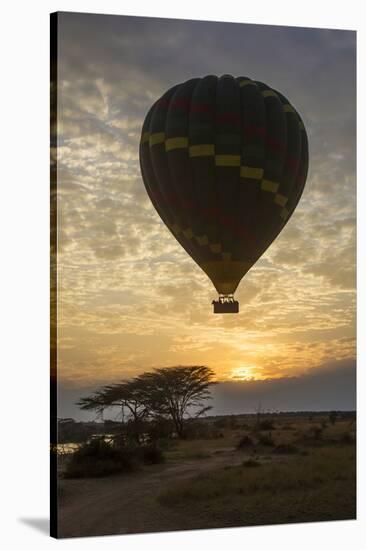 Africa. Tanzania. Hot air balloon crossing the Mara River, Serengeti National Park.-Ralph H. Bendjebar-Stretched Canvas