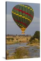 Africa. Tanzania. Hot air balloon crossing the Mara River, Serengeti National Park.-Ralph H. Bendjebar-Stretched Canvas