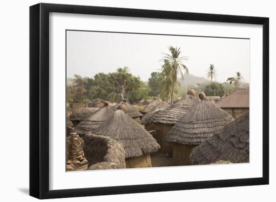 Africa, West Africa, Benin, Beri. Thatched rooves of traditional dwellings in front of palm trees.-Alida Latham-Framed Photographic Print