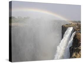 Africa, Zimbabwe, Victoria Falls. Rainbow over Waterfall-Jaynes Gallery-Stretched Canvas