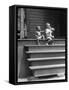 African American Boys at top of Stairs as Older Boy is Drinking Soda and Younger One Reaches for It-Alfred Eisenstaedt-Framed Stretched Canvas
