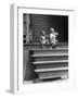 African American Boys at top of Stairs as Older Boy is Drinking Soda and Younger One Reaches for It-Alfred Eisenstaedt-Framed Photographic Print