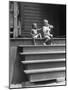 African American Boys at top of Stairs as Older Boy is Drinking Soda and Younger One Reaches for It-Alfred Eisenstaedt-Mounted Photographic Print