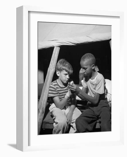 African American Camper Helps a White Bubby with His Bandaged Hand-Gordon Parks-Framed Photo