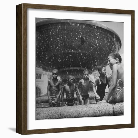 African American Children Playing in a Fountain-Marie Hansen-Framed Photographic Print