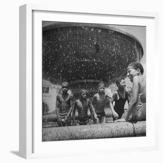 African American Children Playing in a Fountain-Marie Hansen-Framed Photographic Print