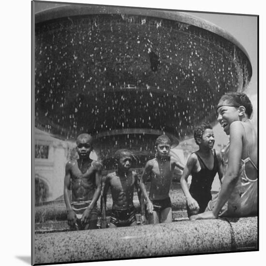 African American Children Playing in a Fountain-Marie Hansen-Mounted Photographic Print