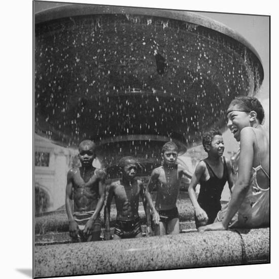 African American Children Playing in a Fountain-Marie Hansen-Mounted Photographic Print
