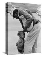 African American Man Comforts Crying Child Photograph-Lantern Press-Stretched Canvas