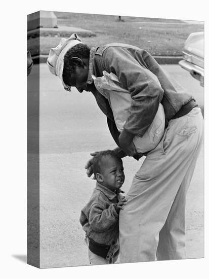 African American Man Comforts Crying Child Photograph-Lantern Press-Stretched Canvas