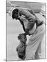 African American Man Comforts Crying Child Photograph-Lantern Press-Mounted Art Print